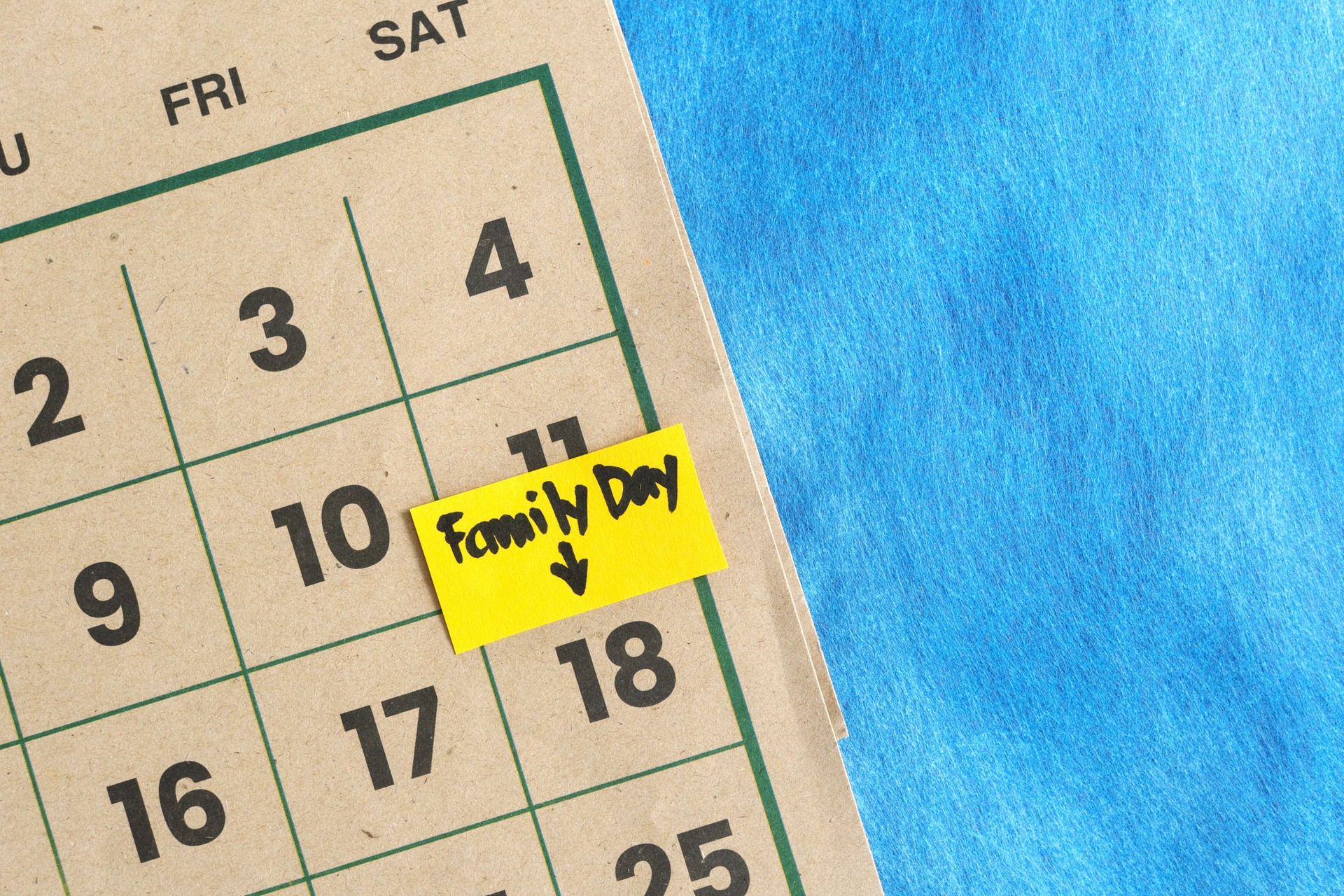 Family day on weekends schedule concept. Written reminder note on calendar.